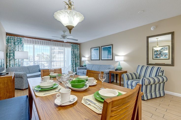 image Gather for memorable meals in the inviting full kitchen and dining area, perfect for family gatherings after a day at the beach.