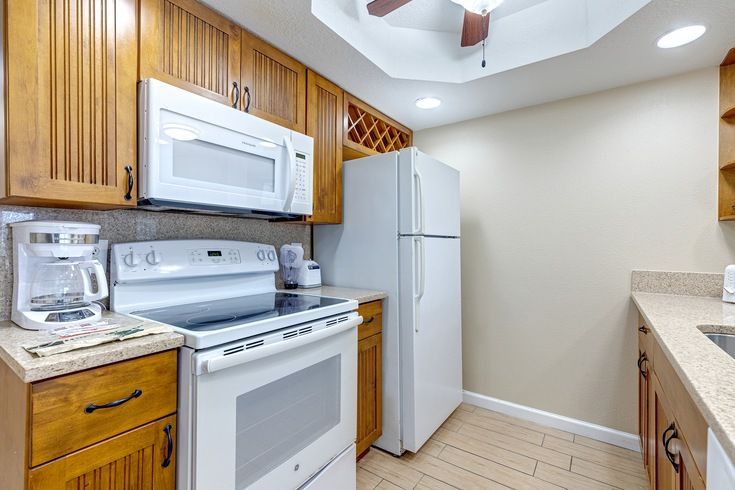 image This fully equipped kitchen boasts modern appliances and ample counter space, making family meal preparations both convenient and enjoyable.