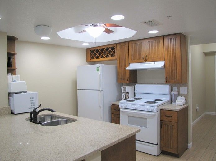 image Cook up a storm in the well-equipped kitchen, complete with modern appliances and ample counter space, making meal preparation a breeze during your beachfront stay.