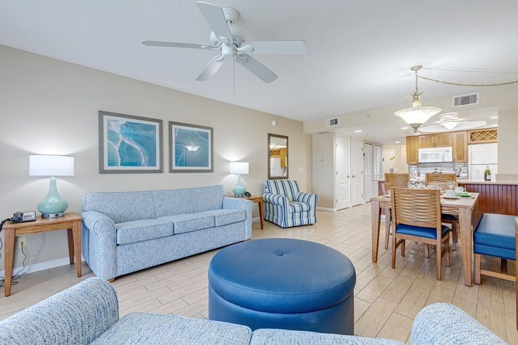 image Embrace a serene environment in this open-plan living area, where stylish decor meets functionality, connecting seamlessly with the kitchen and dining space for family bonding and relaxation.