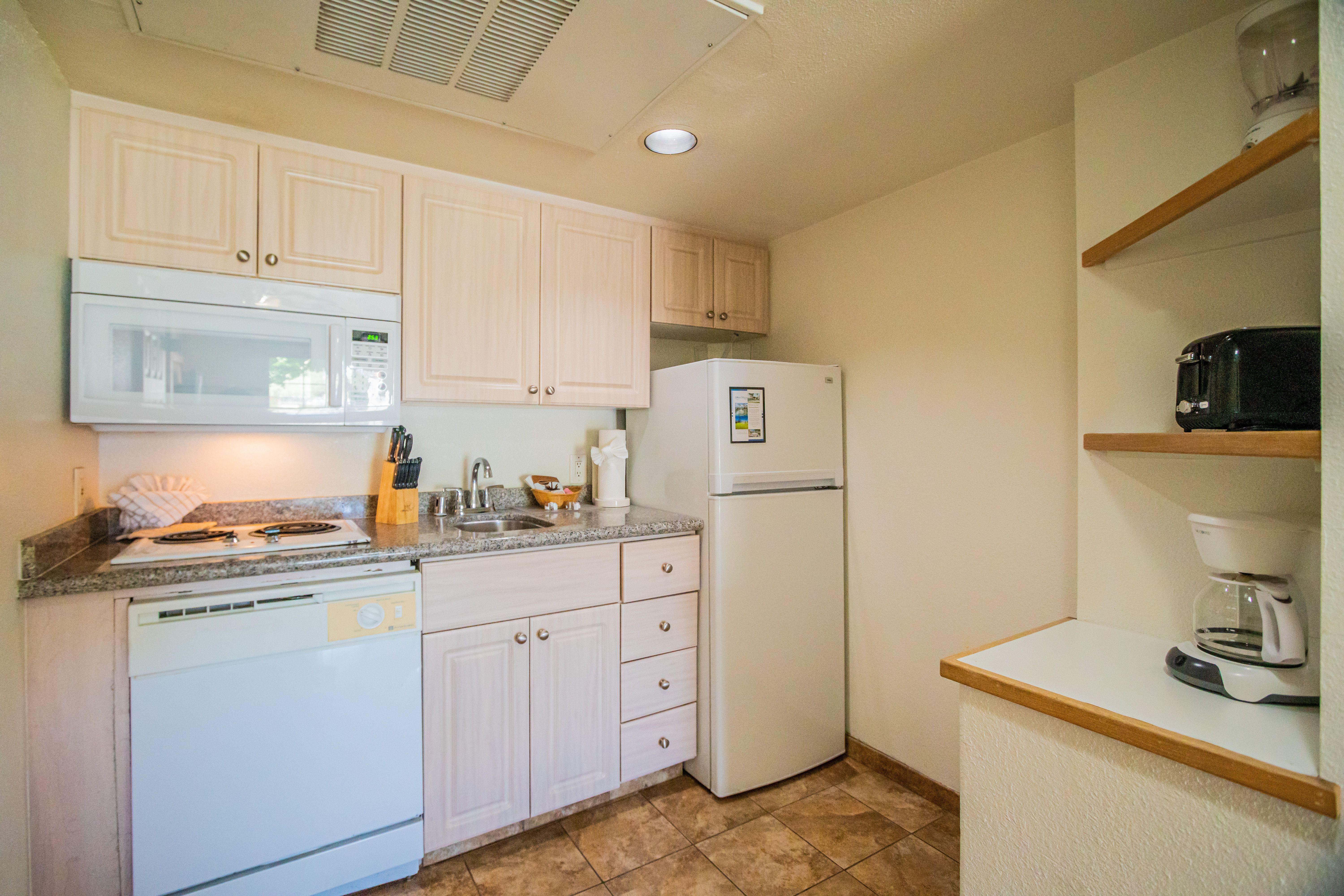 image Step into a fully equipped kitchenette, designed for seamless meal preparation, allowing you to enjoy the comforts of home during your stay.