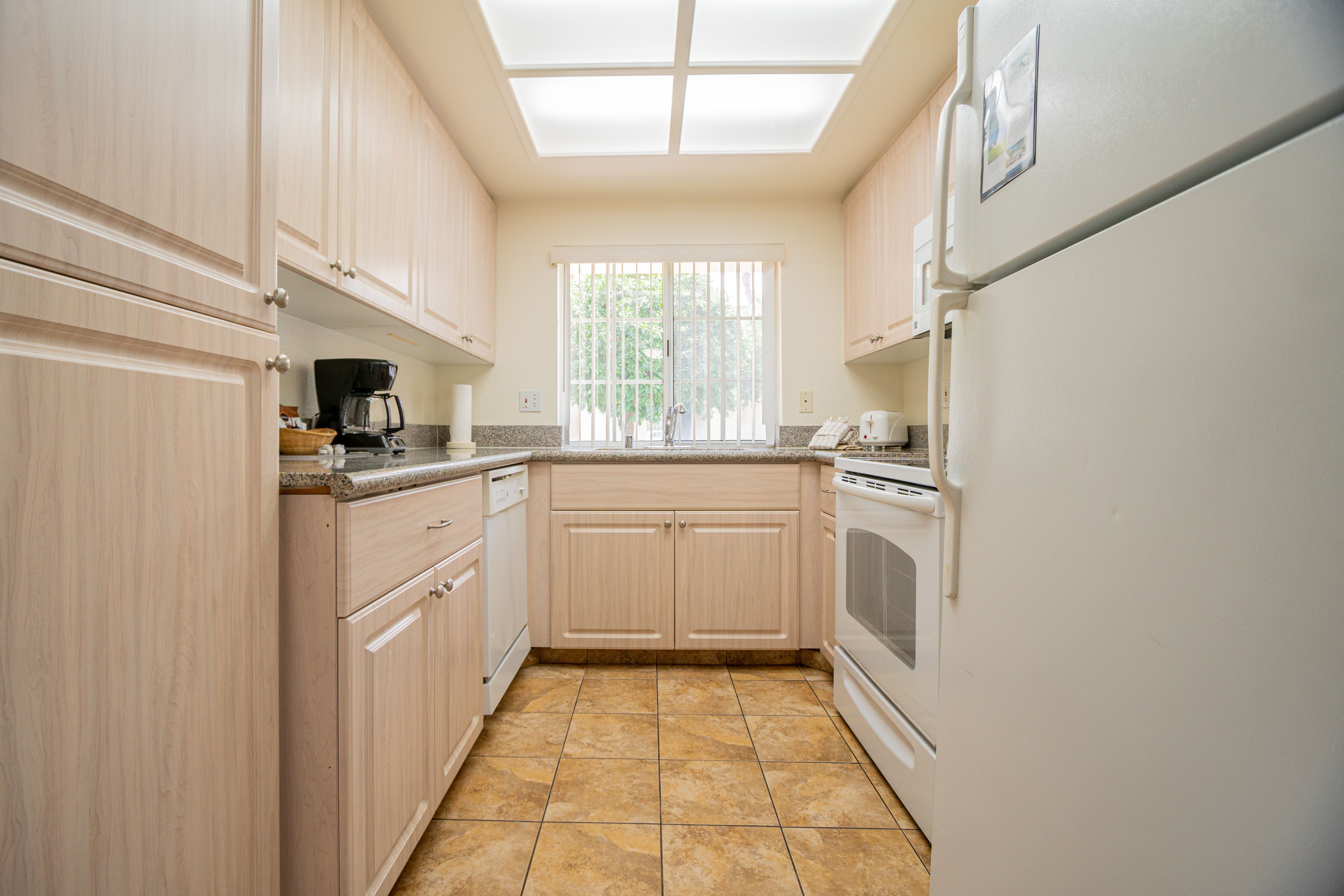 image Experience culinary convenience in this Palm Desert property’s full kitchen, featuring modern appliances and ample counter space for family meals.