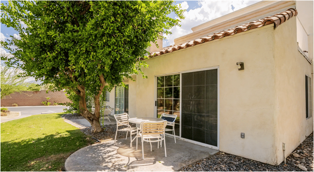image Unwind on your private patio with seating, designed for relaxation amidst the beautiful surroundings, making it perfect for families and multi-generational travelers.