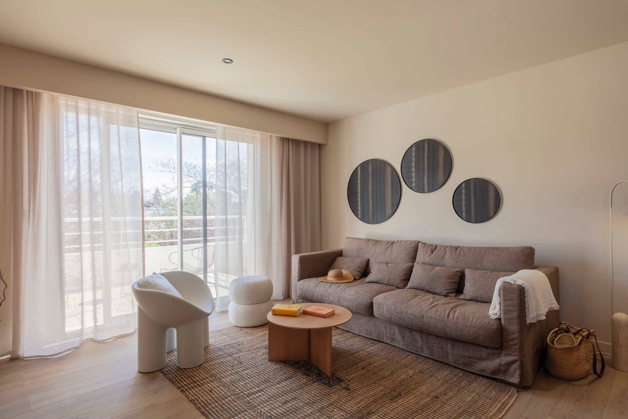 image Cozy living space with modern furnishings and direct terrace access—perfect for lounging or casual dining.
