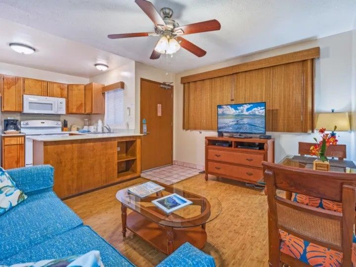 image Bright living area with beachy decor and modern amenities
