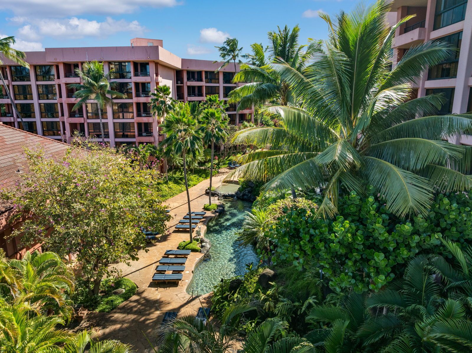 image Lush tropical paradise with serene poolside lounging options