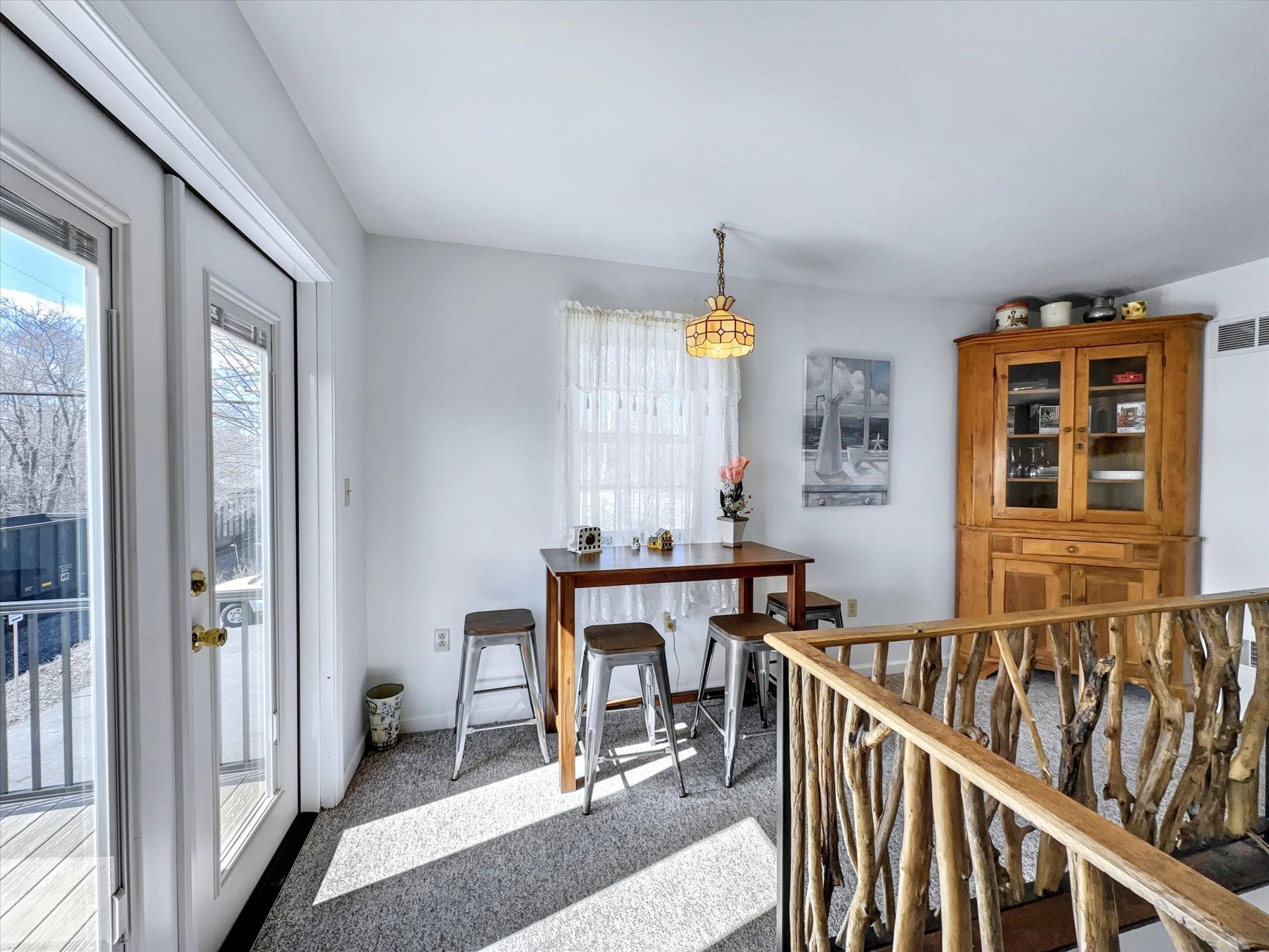 image Charming dining nook with natural light and easy access to the deck—perfect for leisurely meals.