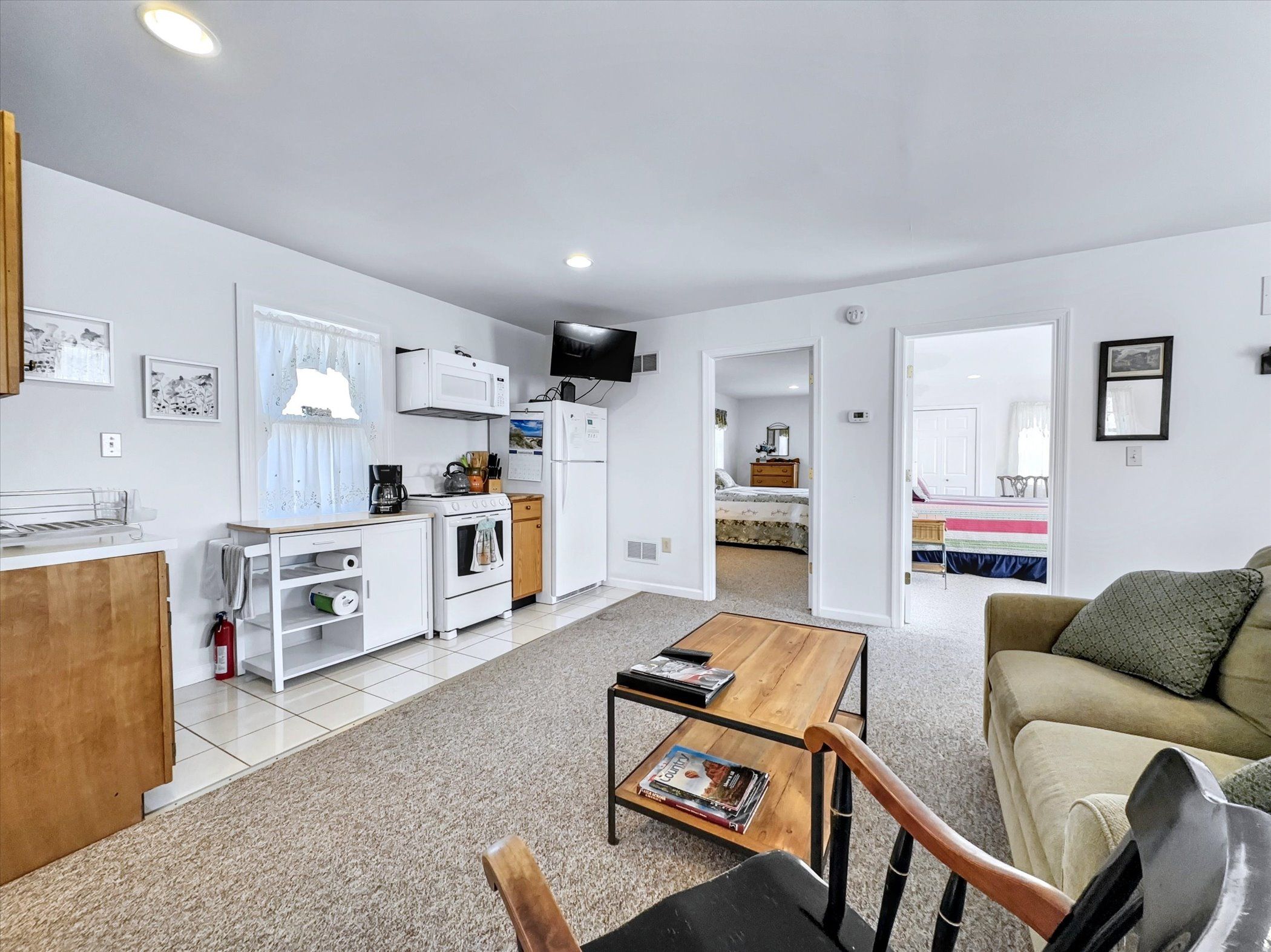 image Cozy open-concept living area with plush seating and a TV, ideal for relaxing after exploring Columbia.