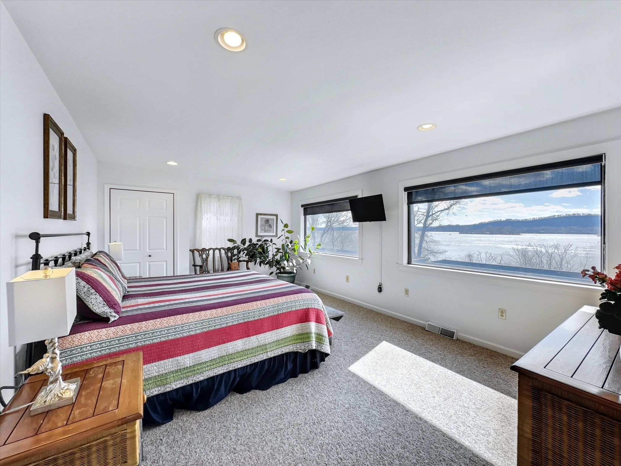 image Wake up to river views from this king bedroom—your serene retreat after a day of outdoor adventure.