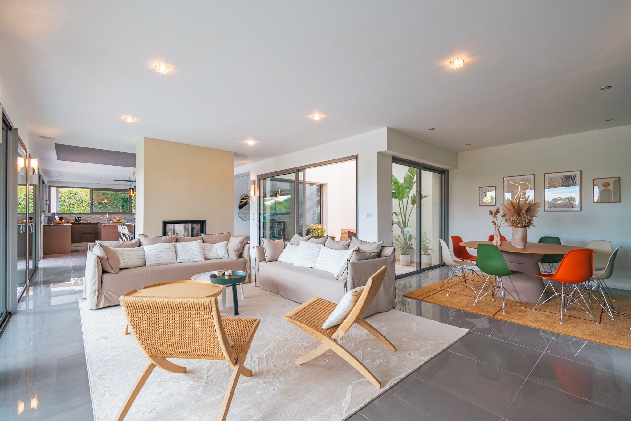 image Open-concept dining and living space filled with natural light—designed for relaxing and entertaining with ease.