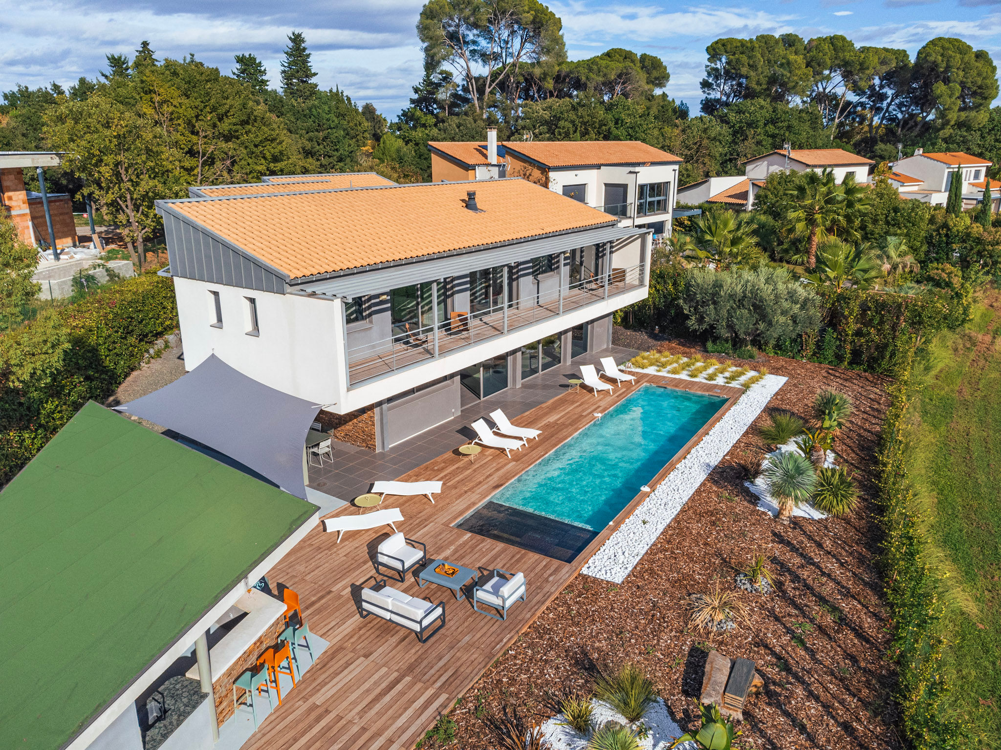 image Aerial view of Villa Horizon showcasing the private pool, sun loungers, and lush Mediterranean garden nestled along the golf course.