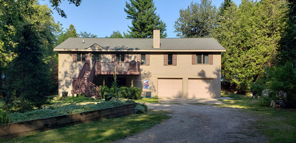 image Welcome to your serene North Shore retreat, tucked away in lush greenery with no neighbors in sight for total privacy.