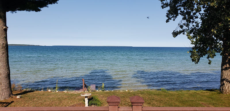 image Just steps from the house, enjoy breathtaking sunsets and direct access to the calm waters of the North Shore.