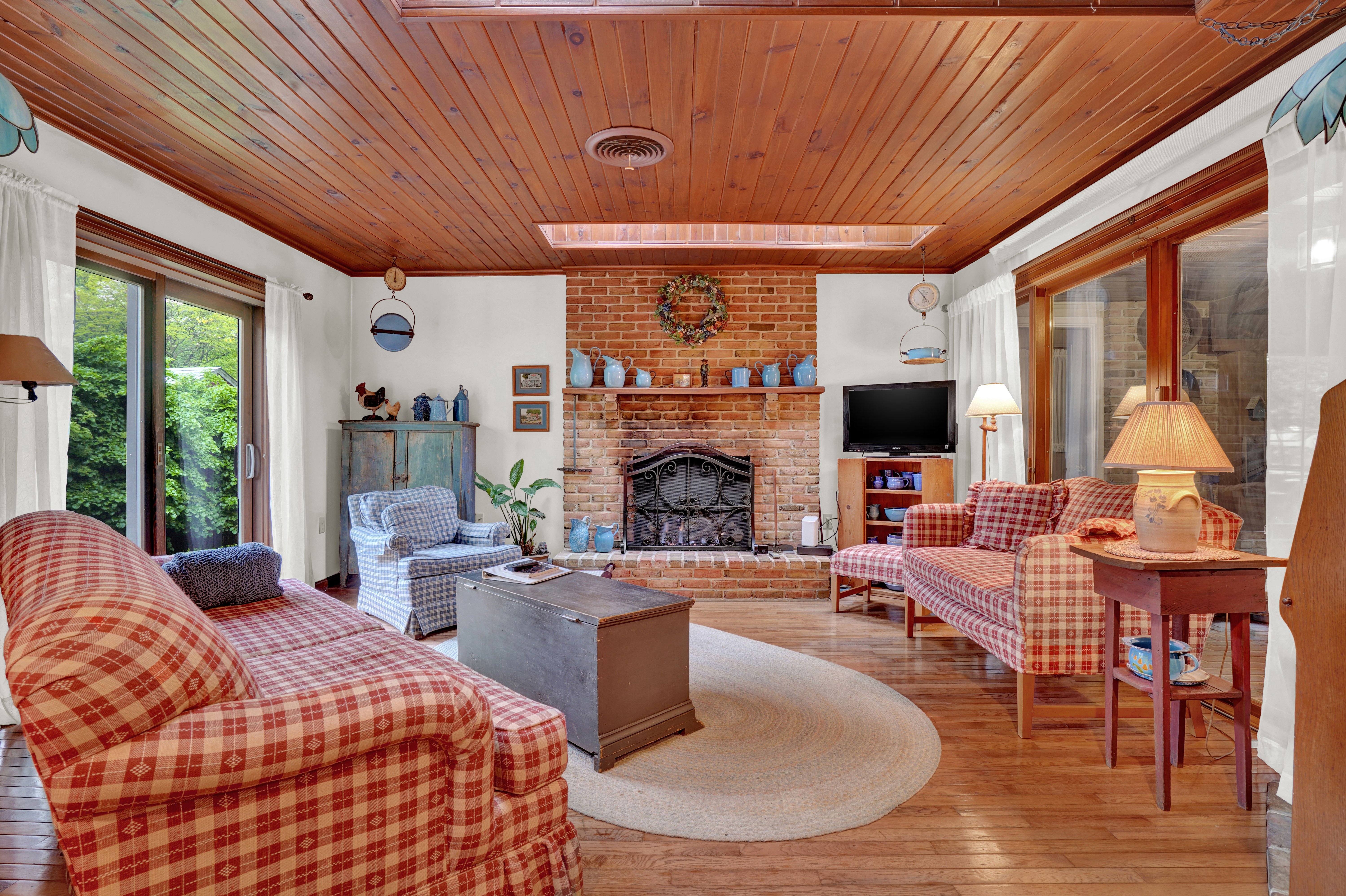 image Warm and inviting living room with antique furnishings, perfect for relaxing with family or friends.