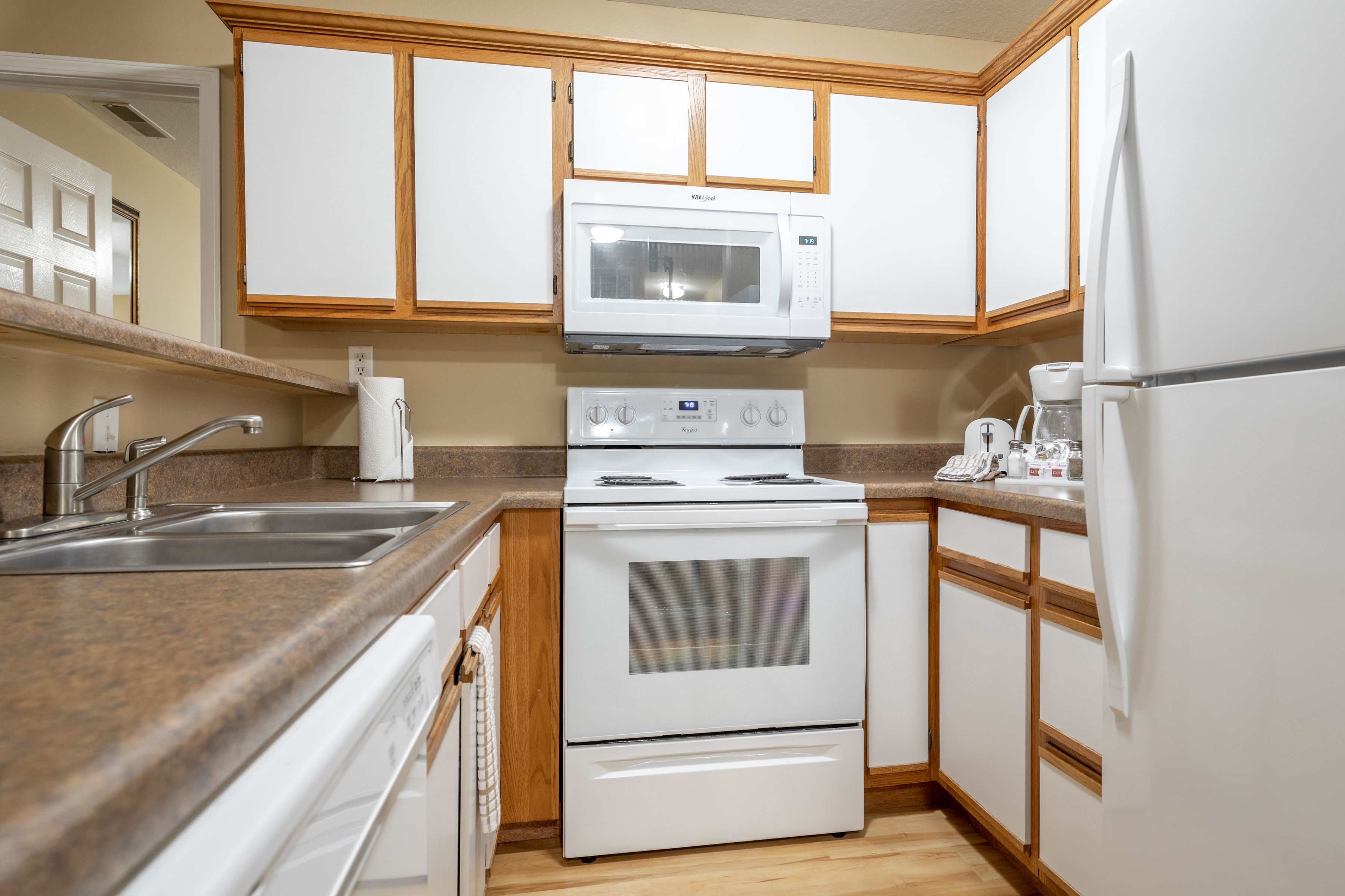 image Cook in the fully equipped kitchen with modern appliances and generous counter space.