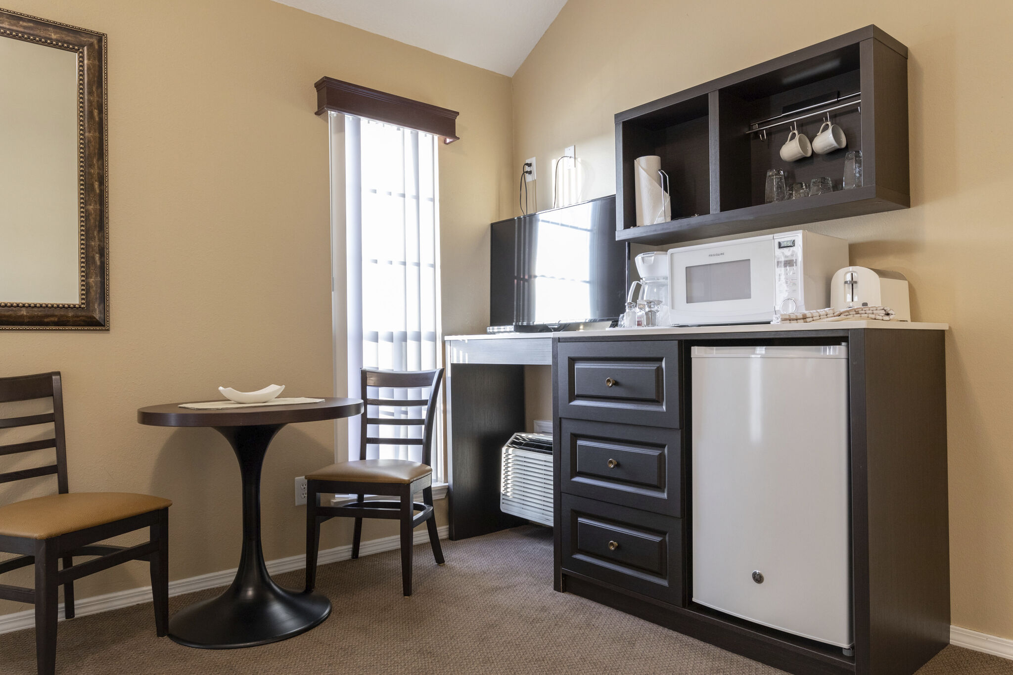 image Prepare light meals in the compact kitchenette equipped with essentials.