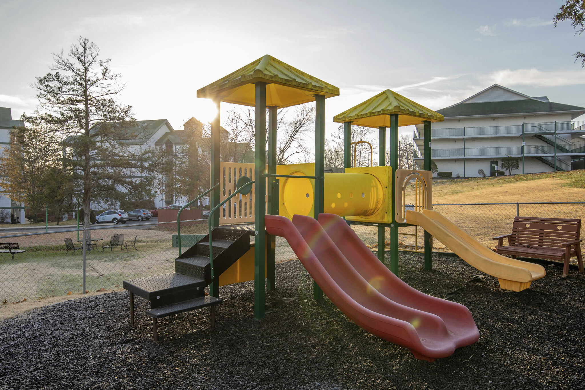 image Let kids play freely on a colorful outdoor playground.