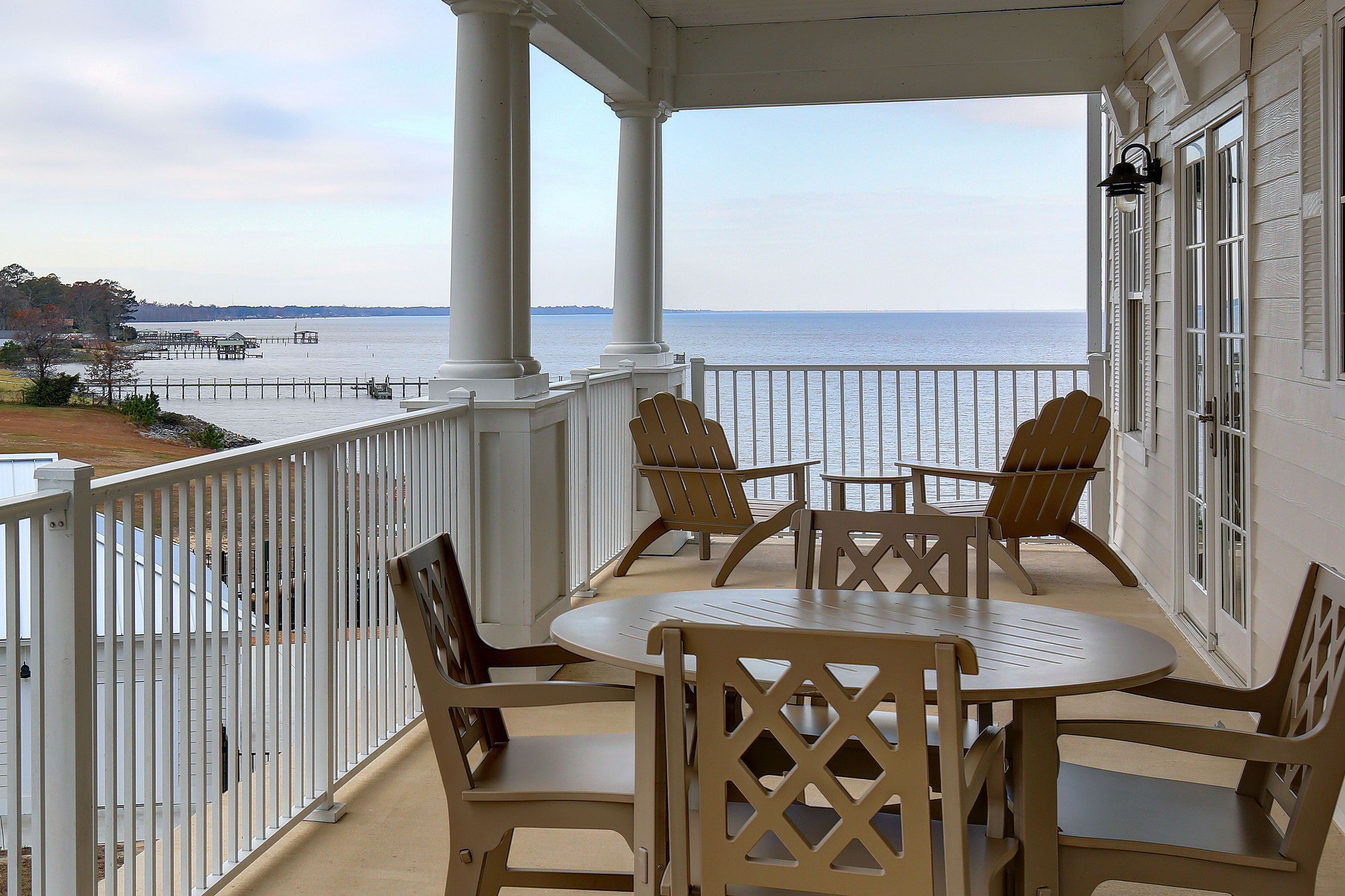 image Balcony with outdoor furniture and a view of the water.