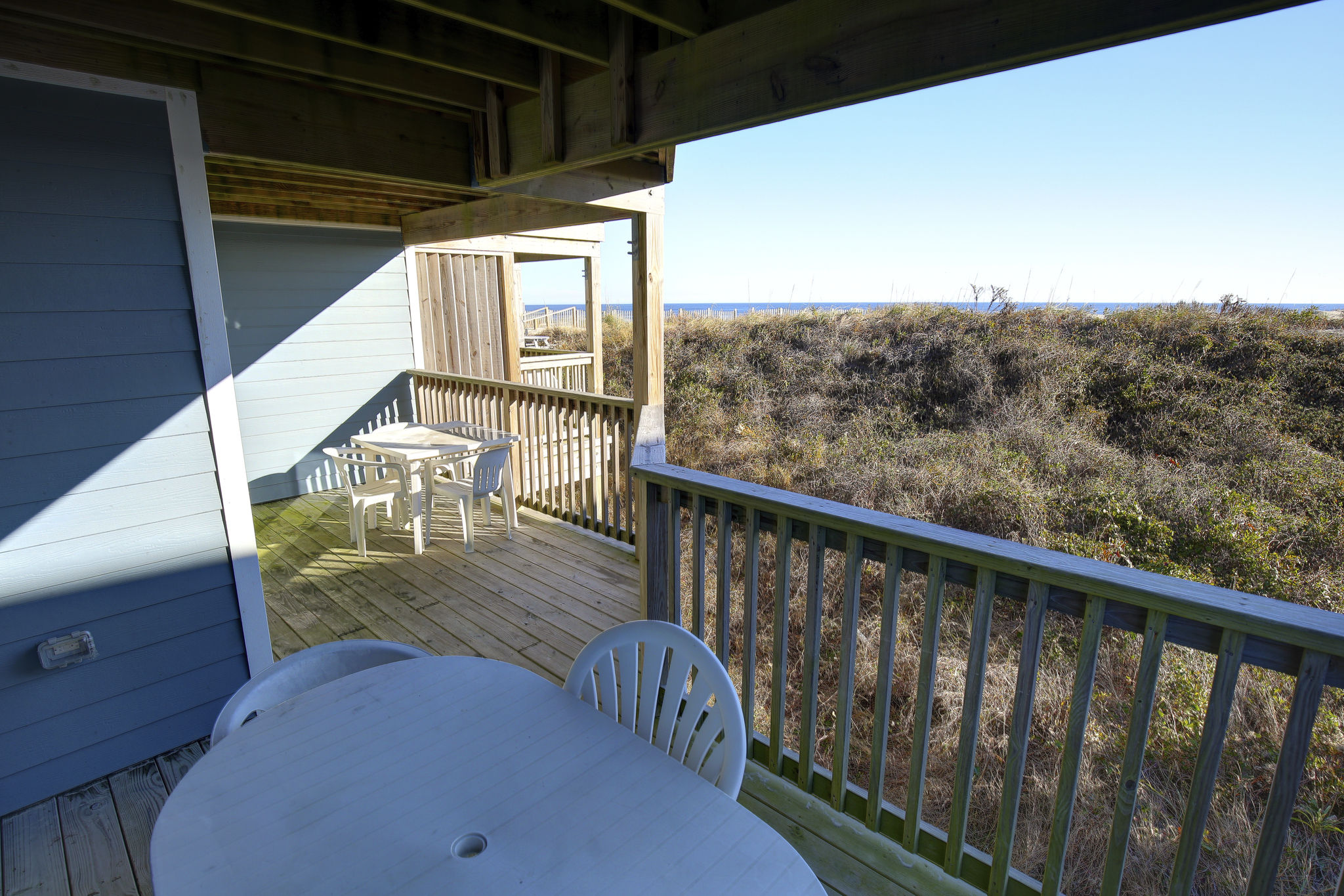 image Savor morning coffee or evening sunsets on your cozy private balcony overlooking the lush surroundings.