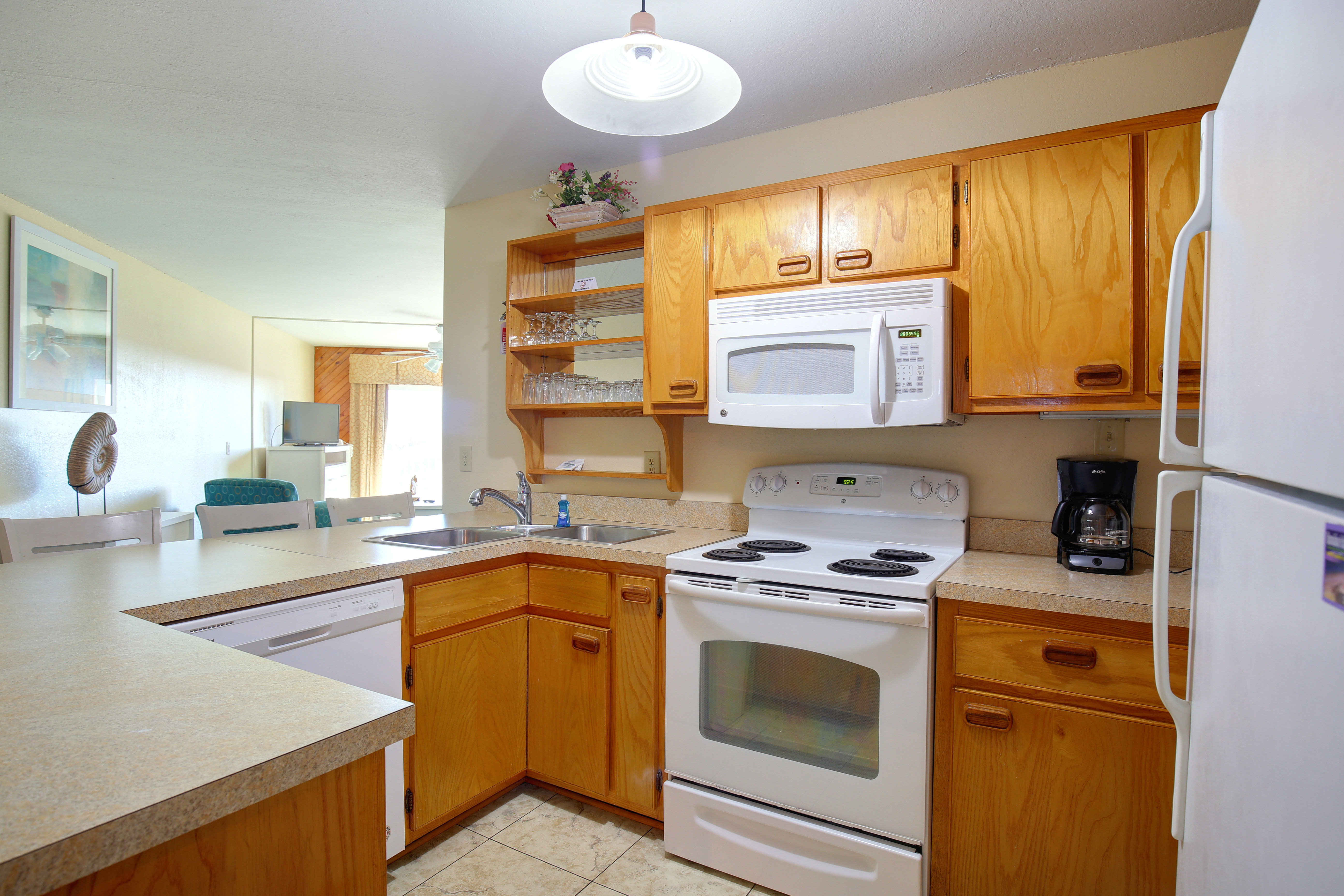 image This cozy 1BR condo at Ocean Pines Resort features a fully equipped kitchen with modern appliances, offering a perfect space for couples or small families to enjoy ocean views and the comforts of home.