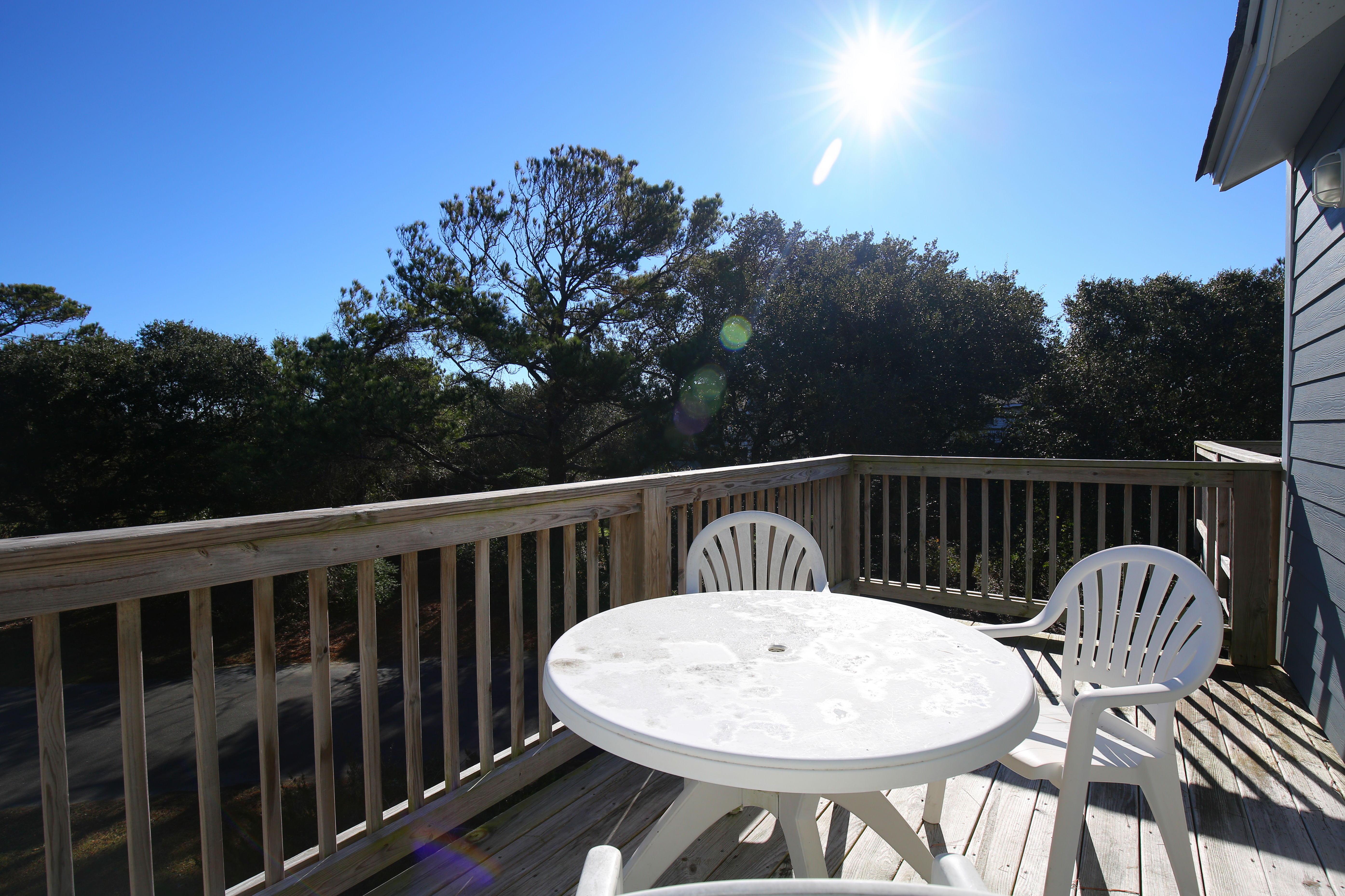 image The sunny private balcony is a delightful space for morning coffee or afternoon relaxation amidst the natural beauty of Duck, NC.