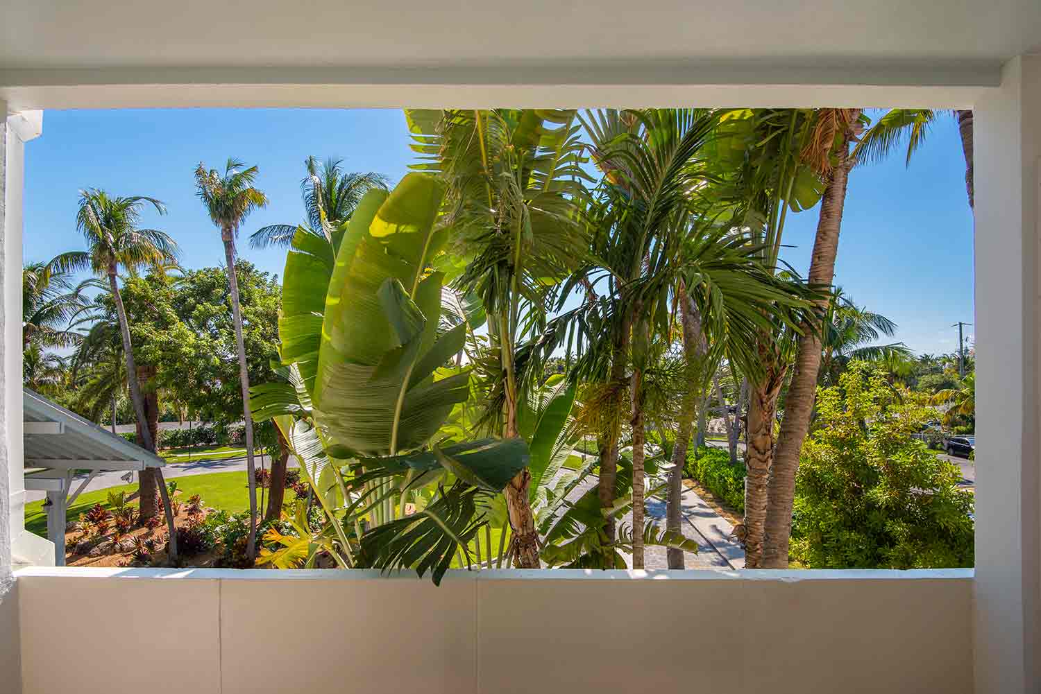 image This comfy room features a private furnished balcony with picturesque views of the expansive resort grounds. 