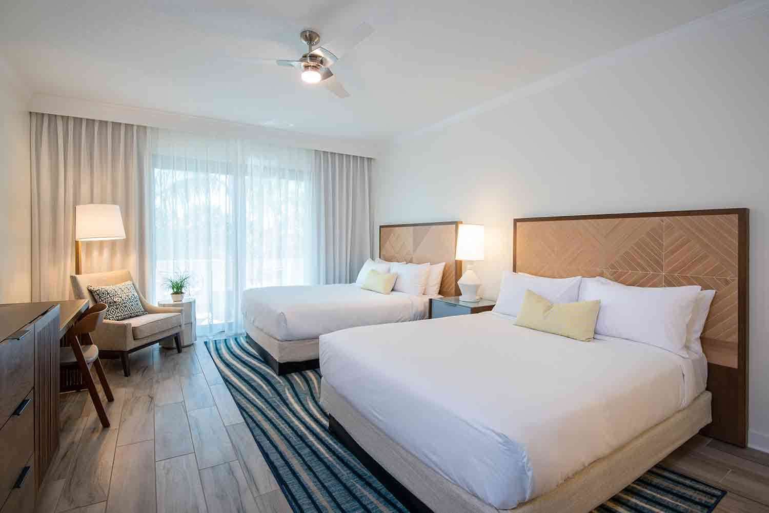 image Stretch out and settle in where sun-dappled curtains, cozy textures, and open space welcome easy island living.