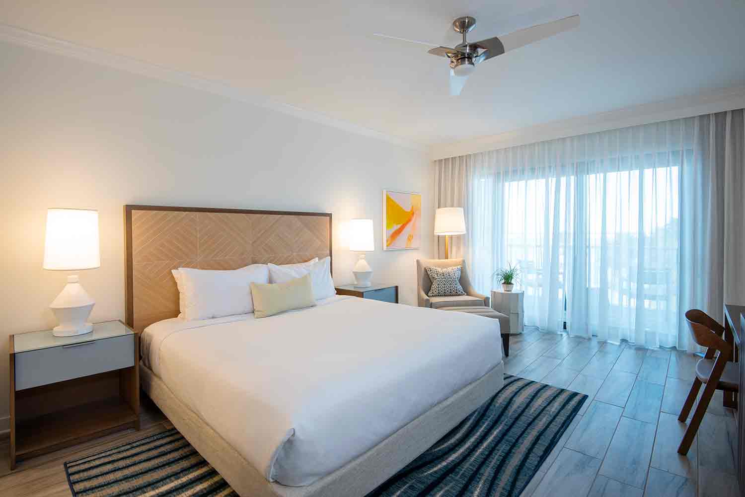 image Wake to golden morning light filtering through sheer curtains, perfect for slow starts and ocean daydreams.