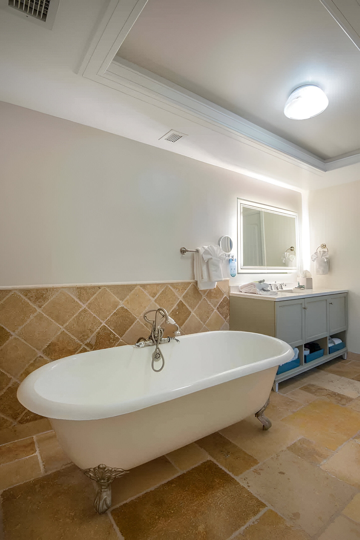 image Slip into pure relaxation with a timeless soak surrounded by warm tones and calming details.