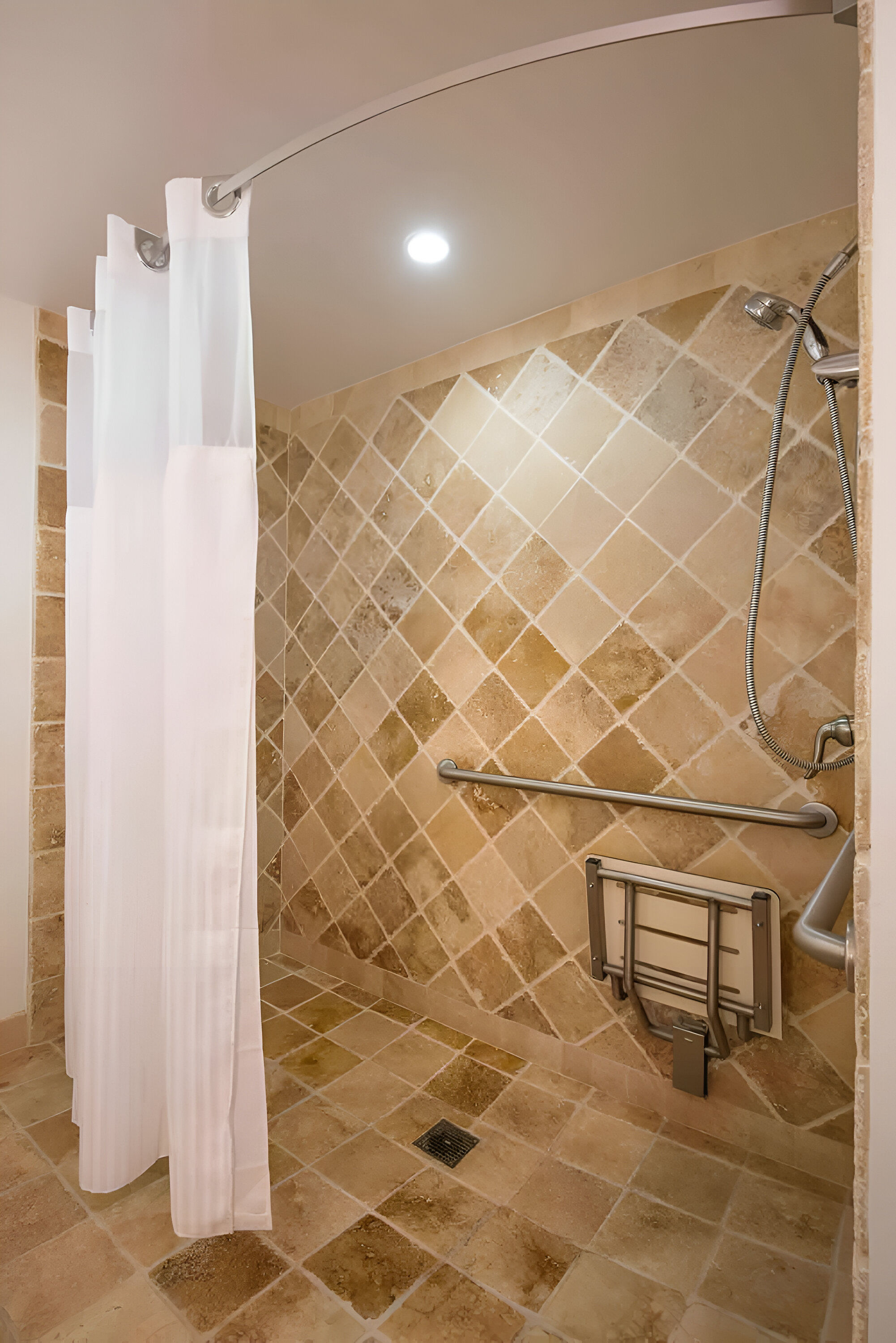 image Wash away the day beneath a gentle stream in this warm, earthy shower designed for simple comfort.