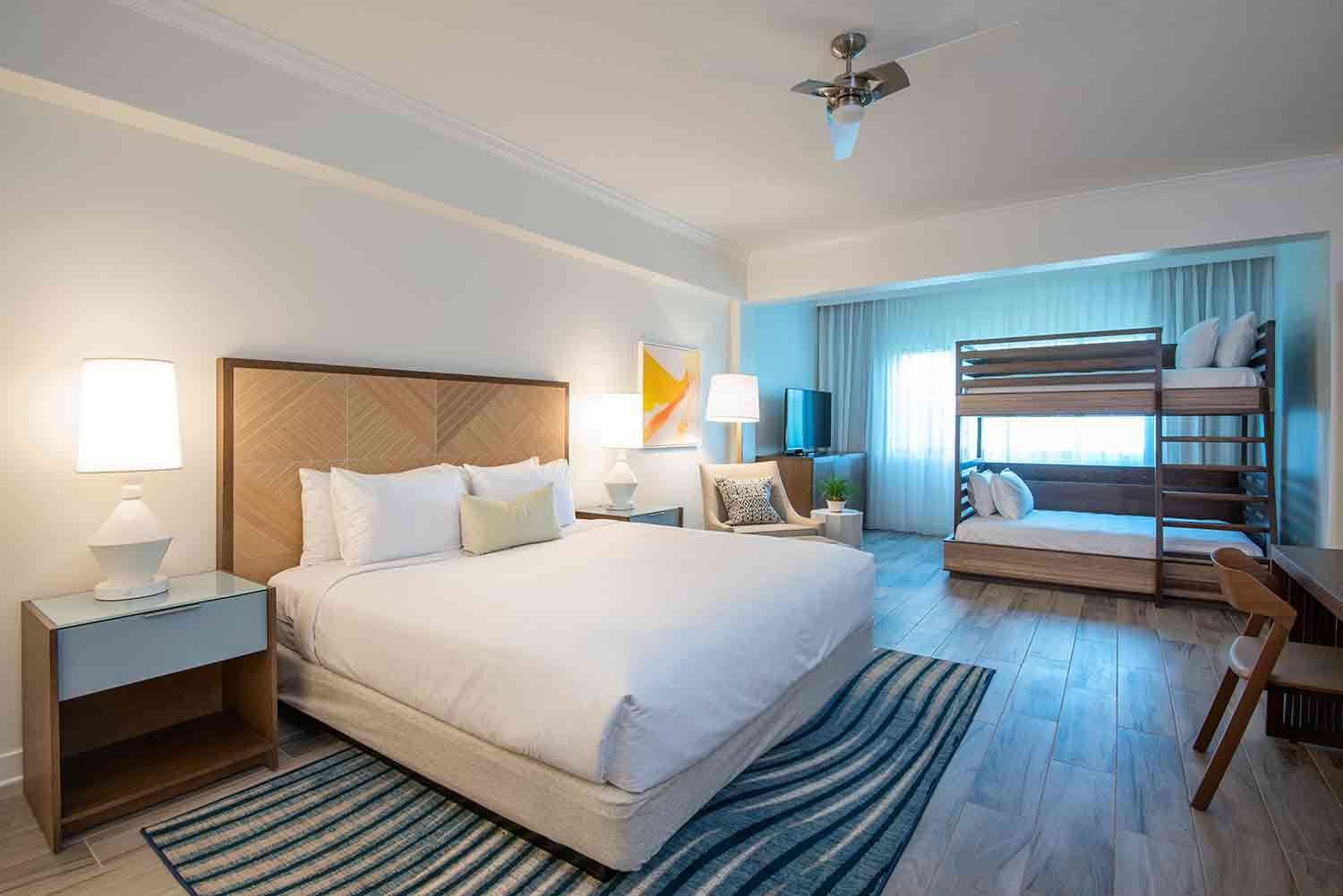 image Create shared memories in a bright, open room designed for connection, comfort, and easy coastal living.