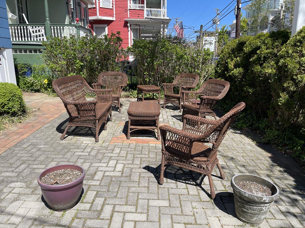 image An inviting outdoor seating area surrounded by greenery offers a perfect spot for social gatherings.