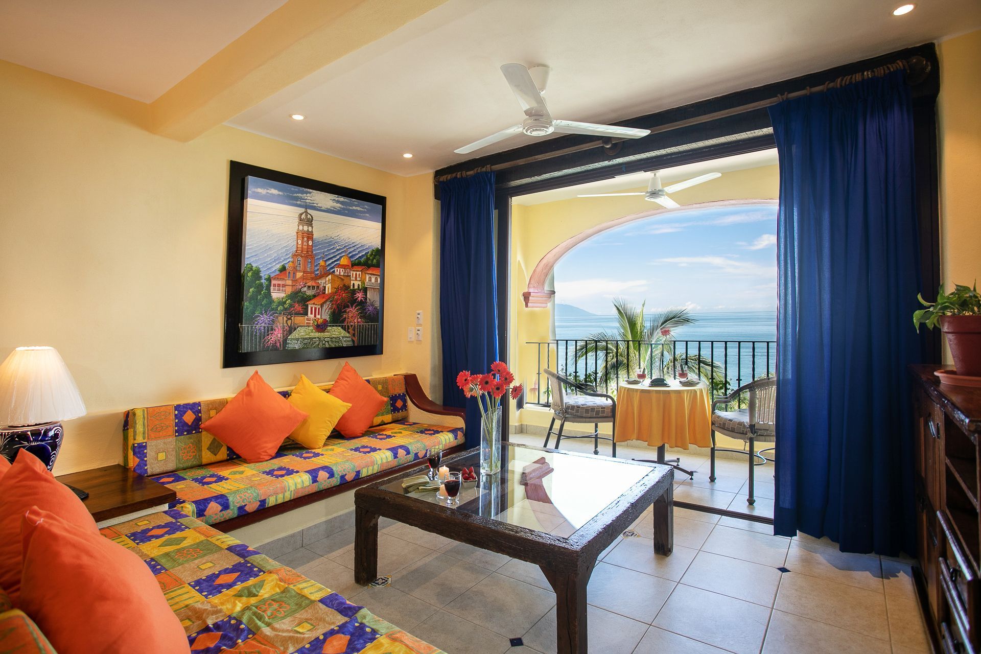 image Step into the cozy living space adorned with vibrant Mexican-inspired decor and expansive views of the sea from the private balcony.