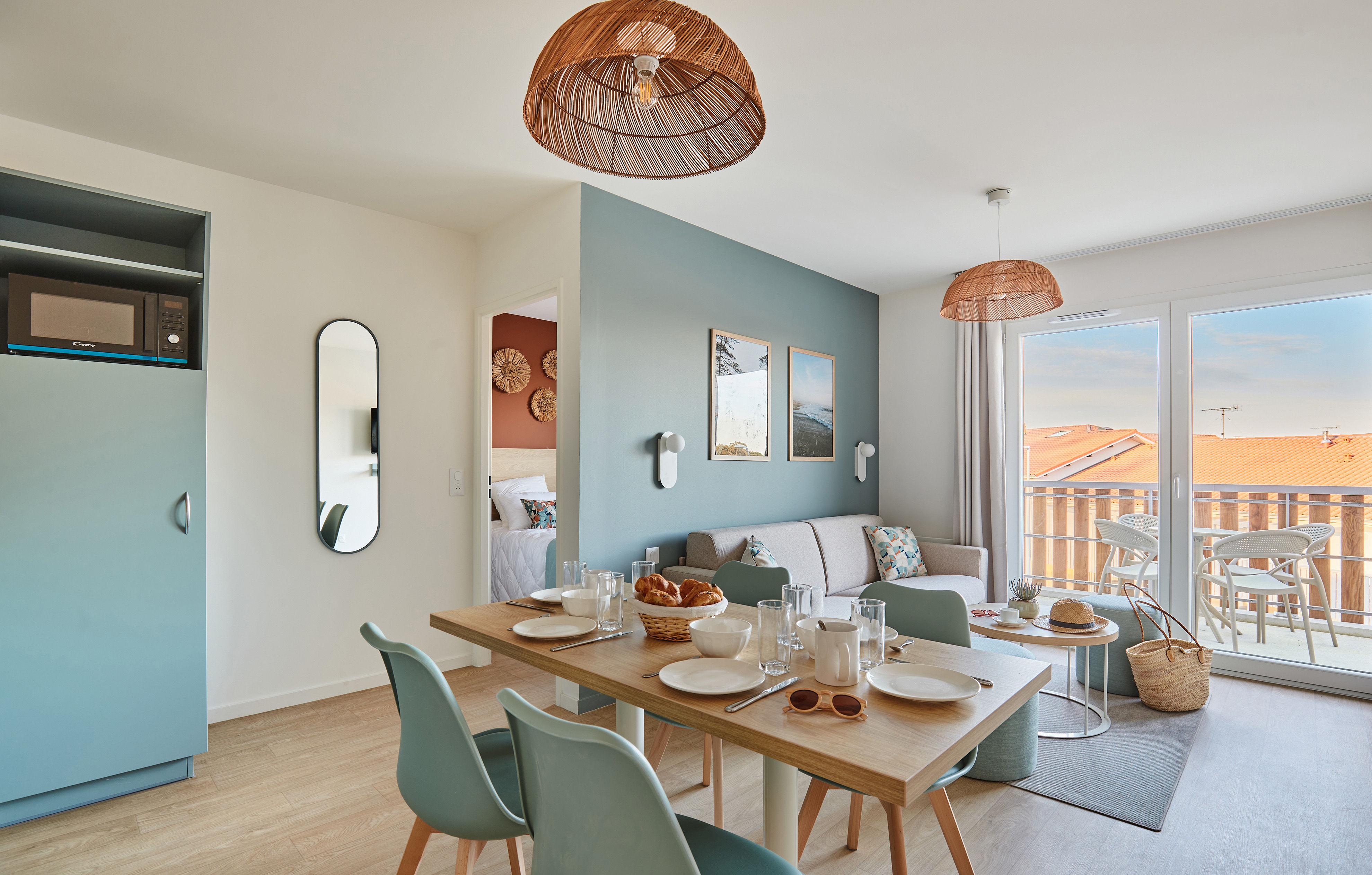 image Highlighting modern amenities, this apartment includes a shared heated pool and sauna, ensuring a relaxing beach getaway with a cozy interior and comfortable furnishings.