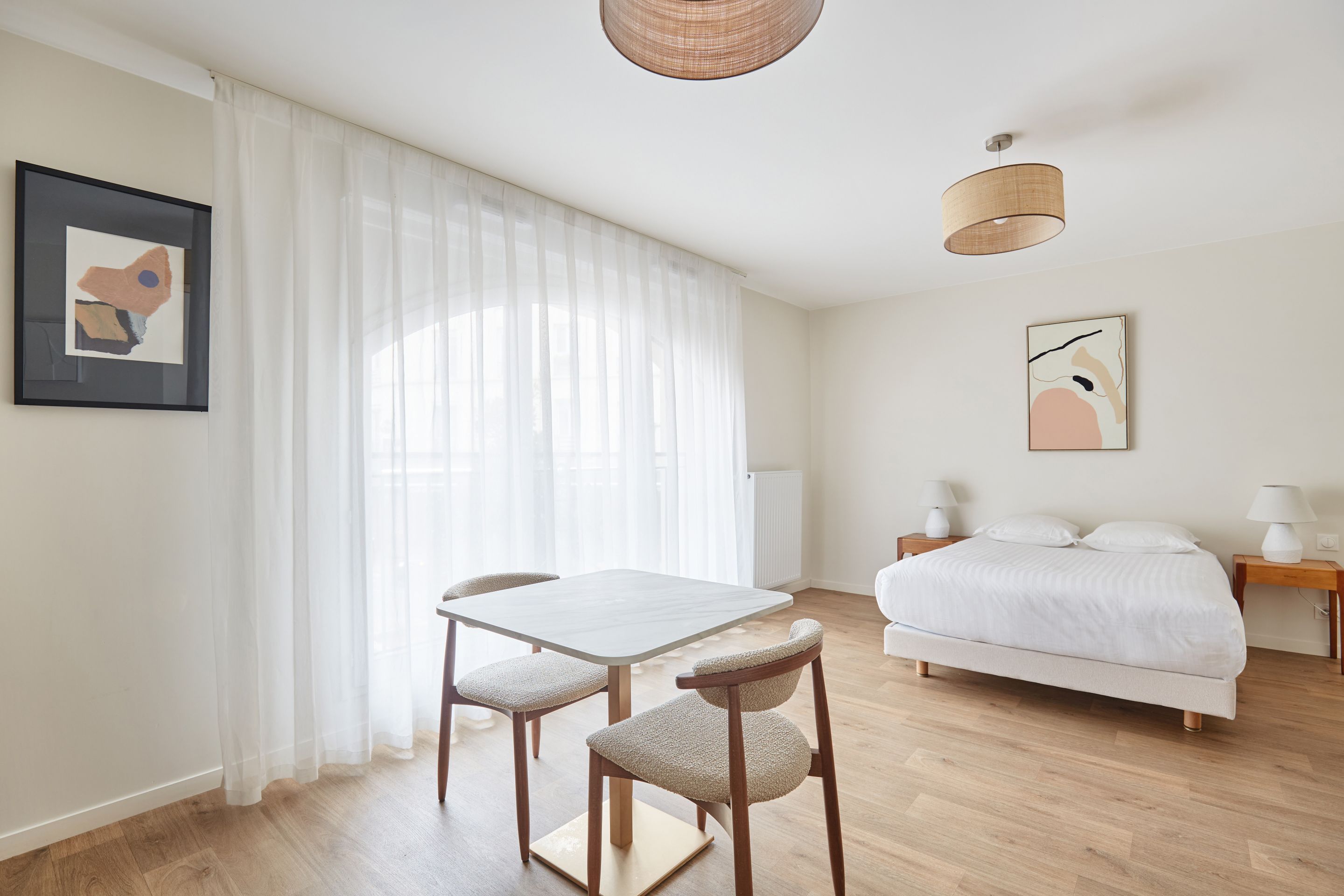 image Thoughtfully arranged studio with natural light and minimalist design, ideal for relaxing between city adventures.