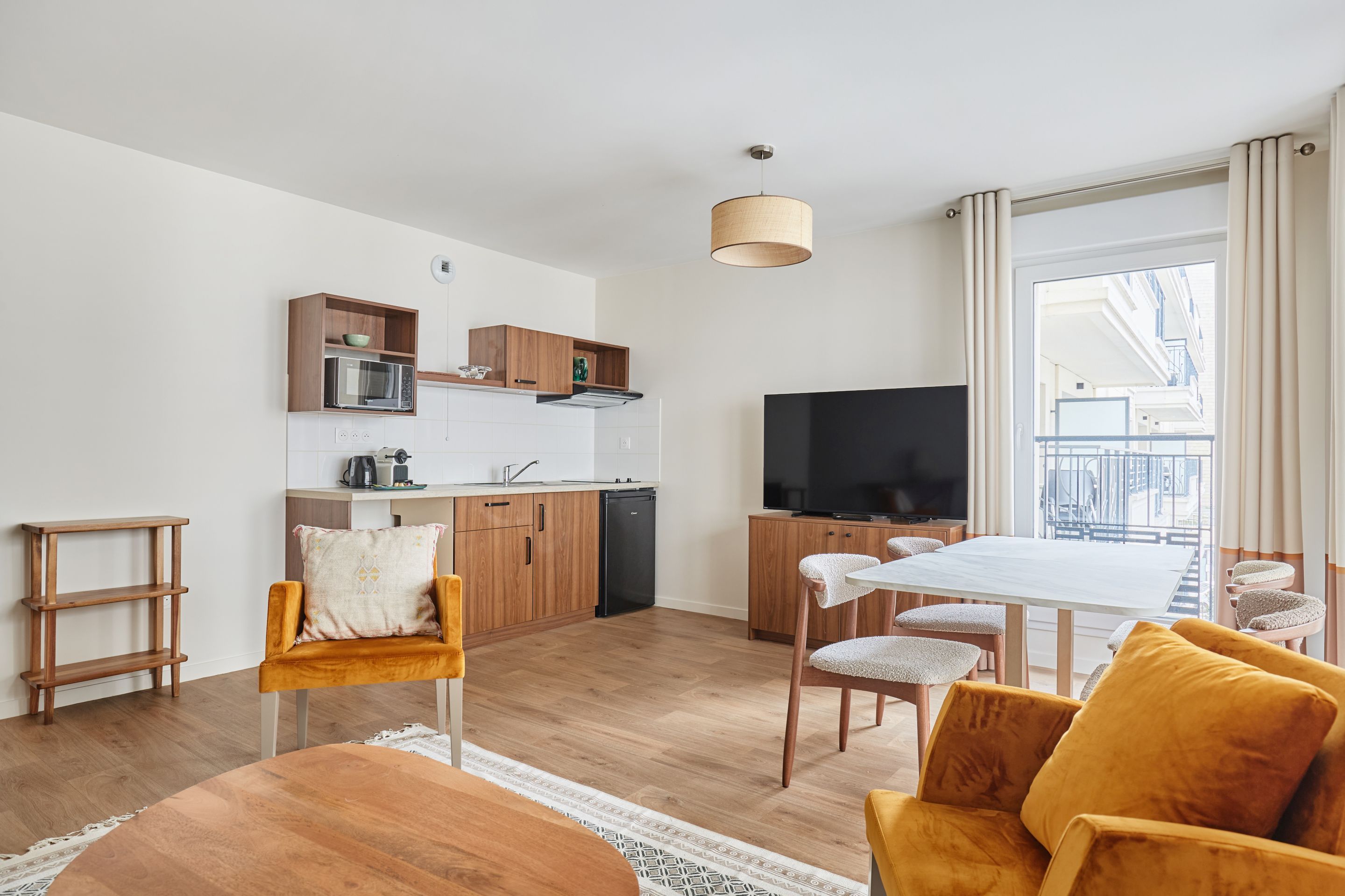 image Open-plan layout with kitchen and lounge combined, offering a bright and sociable space for group stays.