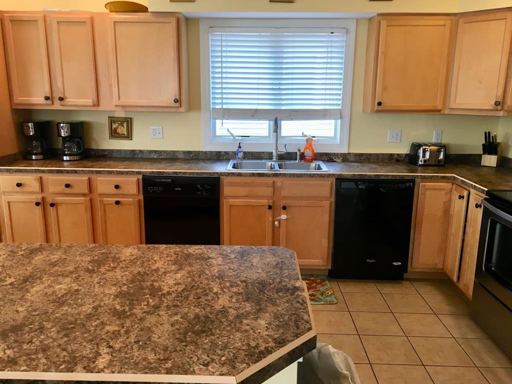 image The kitchen space is thoughtfully organized with dual coffee makers and all essential appliances, making meal prep easy and enjoyable.