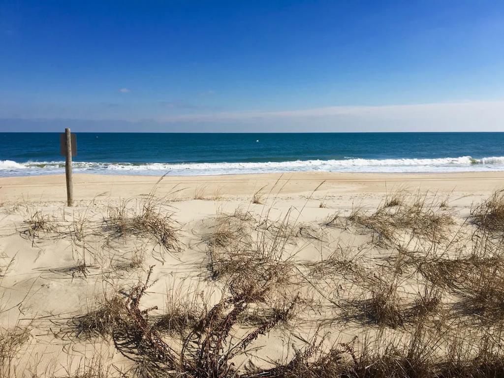 image Bask in the sun and sea breeze at the nearby beach, just moments from your cozy 3-bedroom retreat.