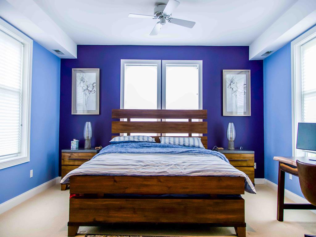 image This stylish room boasts a modern vibe with ample natural light, perfect for work or leisure activities.