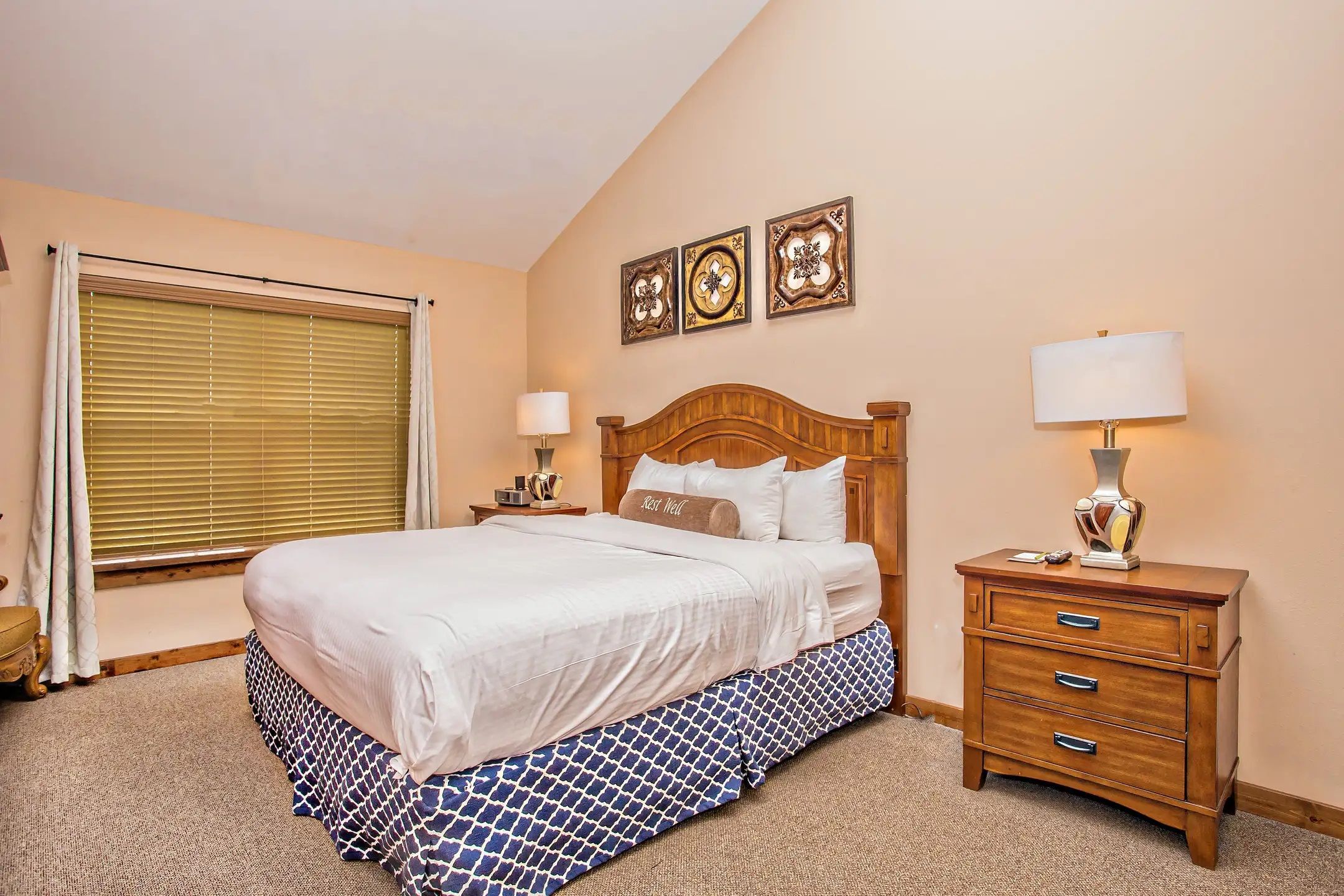 image Another angle of the master bedroom with king bed, nightstand, and soft natural lighting