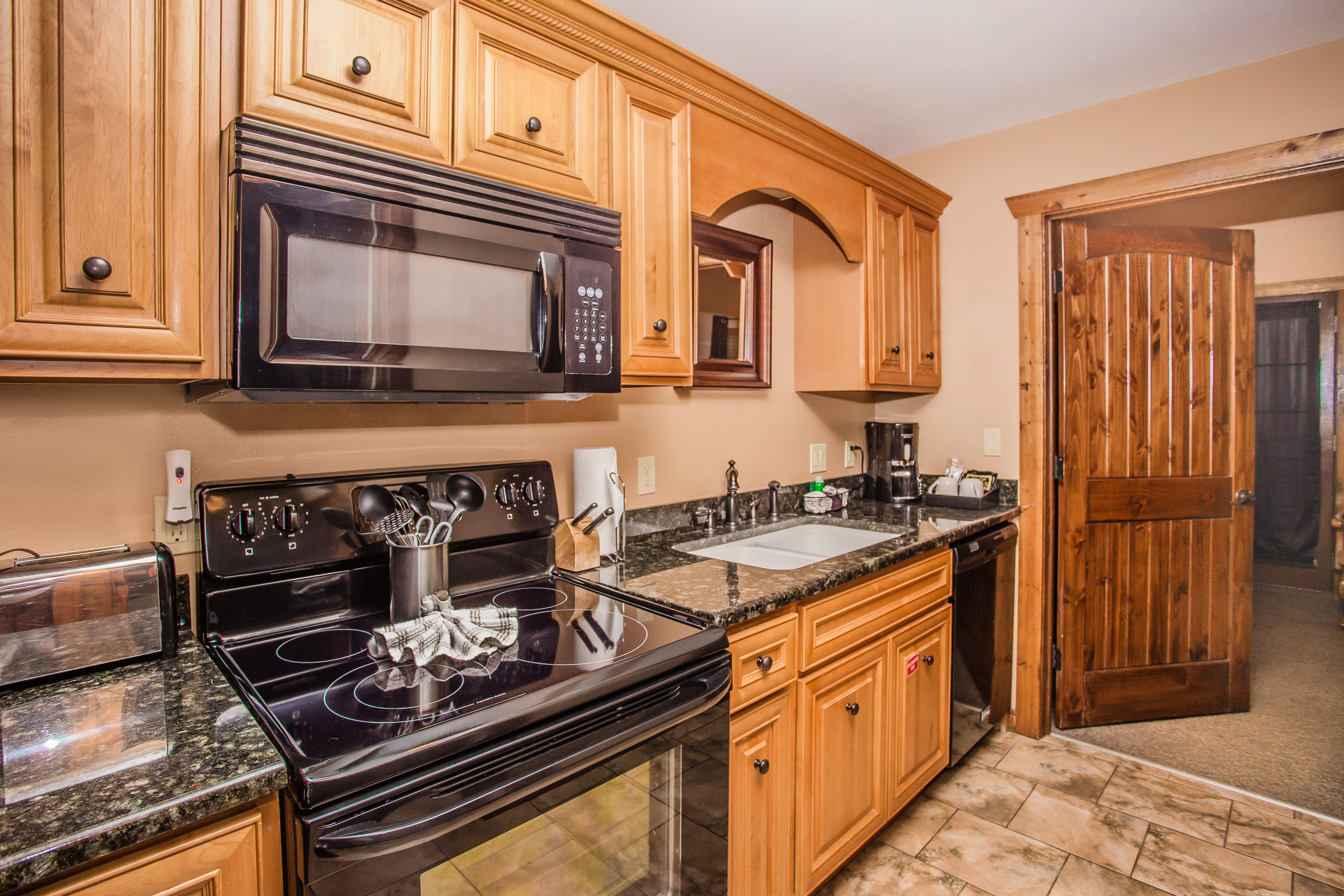 image Kitchen with full-size oven, microwave, and ample counter space.