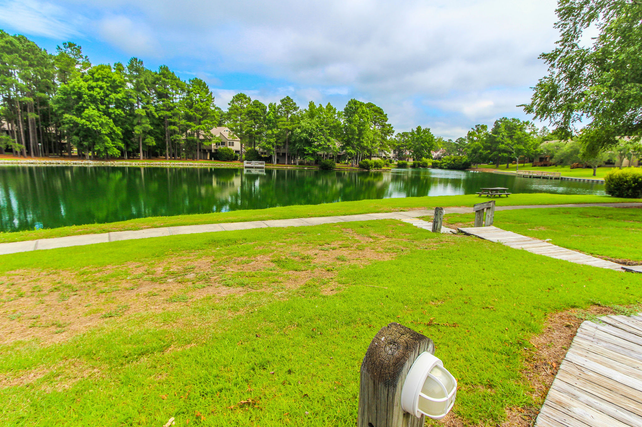 image Take in calming views of the lake and surrounding greenery from just outside your comfortable condo.
