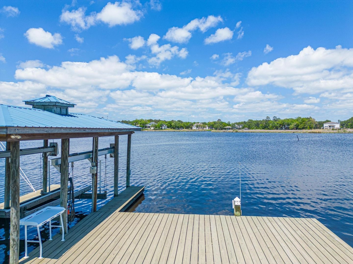 image Enjoy the expansive vistas of the bayou from the private dock, ideal for relaxing and taking in the serene surroundings.