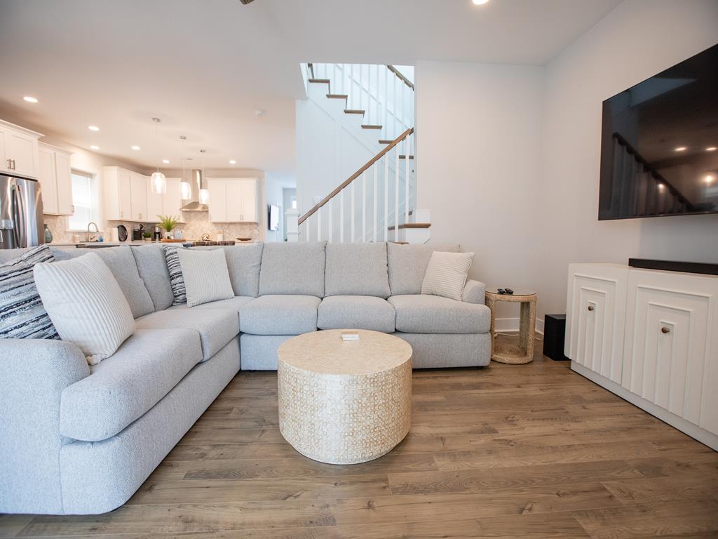 image Comfortable main living area with sectional sofa and smart TV for cozy nights in.