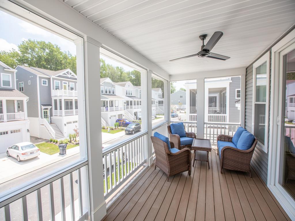 image Top-level screened porch offers another breezy, peaceful outdoor space to enjoy.