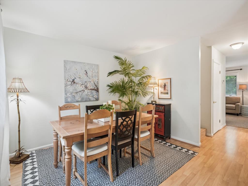 image Charming dining area with seating for six—ideal for family meals or game nights.