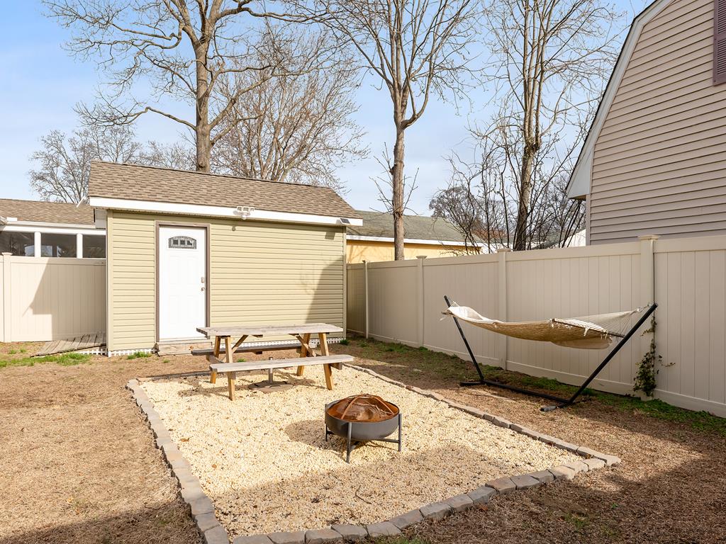 image The spacious backyard comes with a cozy fire pit, hammock, and private fenced area — perfect for evening relaxation or weekend BBQs.