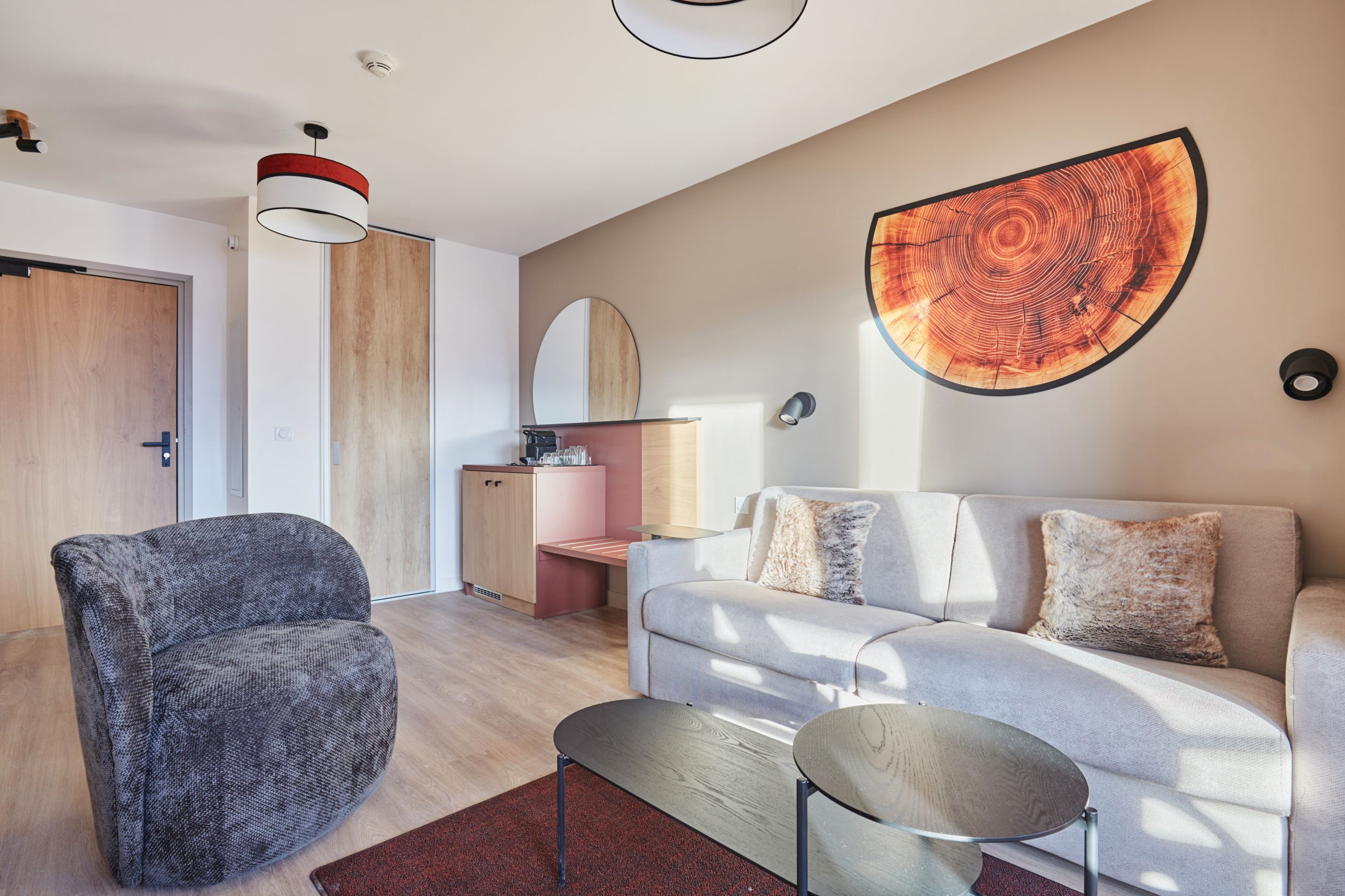 image Bright seating area with natural light and a coffee machine on the cabinet — a practical base for mountain days.