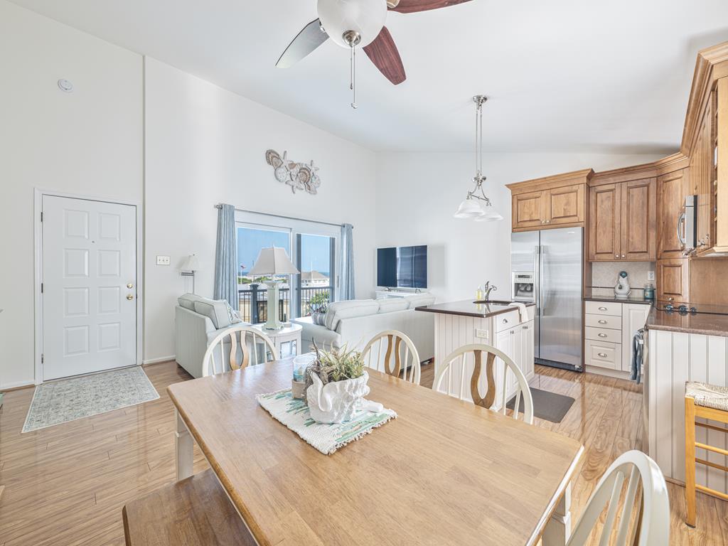 image Open-concept kitchen and dining area ideal for group meals and entertaining.