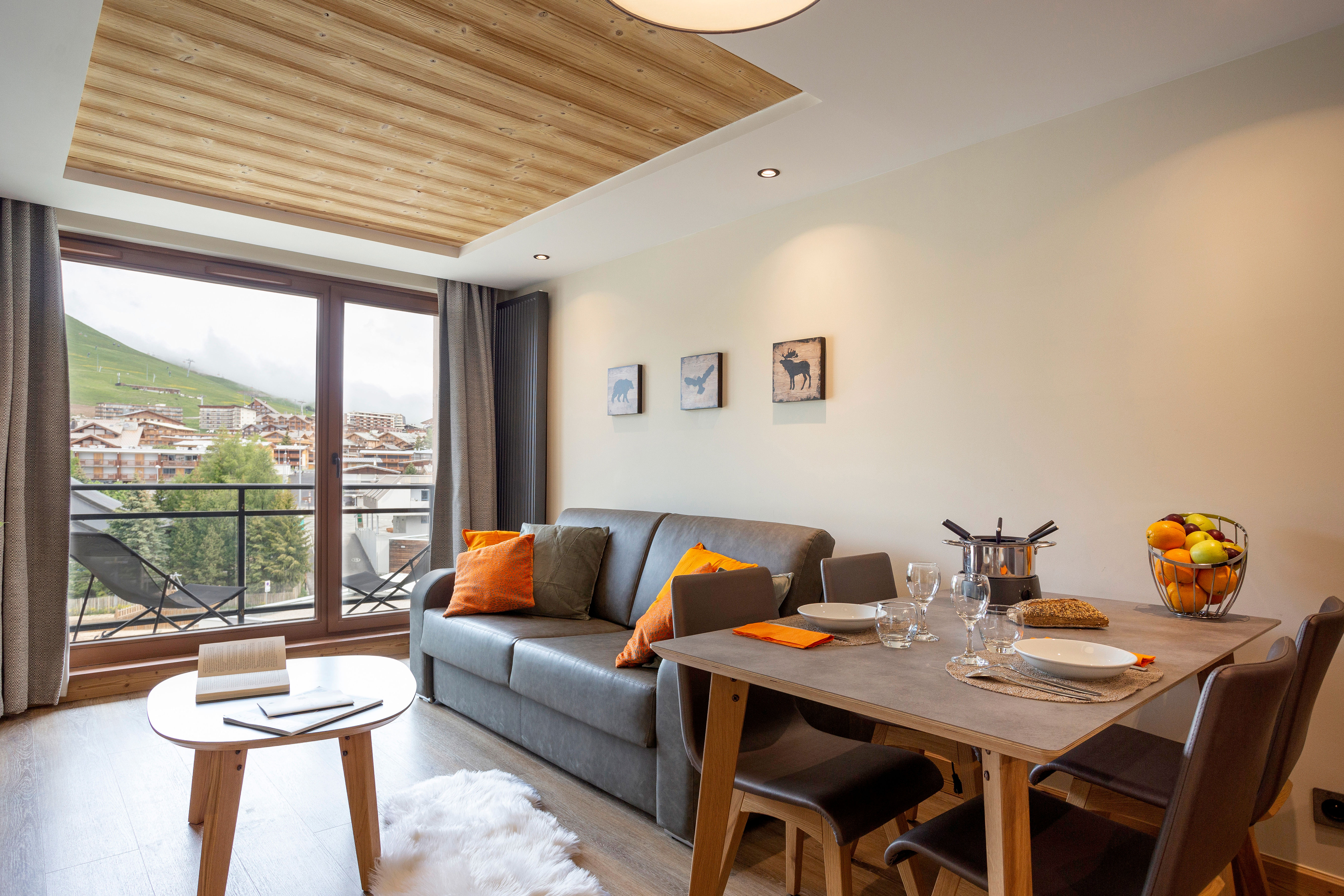 image Dining nook with plush seating and scenic balcony access — a perfect blend of charm and light.